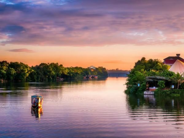 Experience the Perfume River's tranquil beauty on a dragon boat cruise